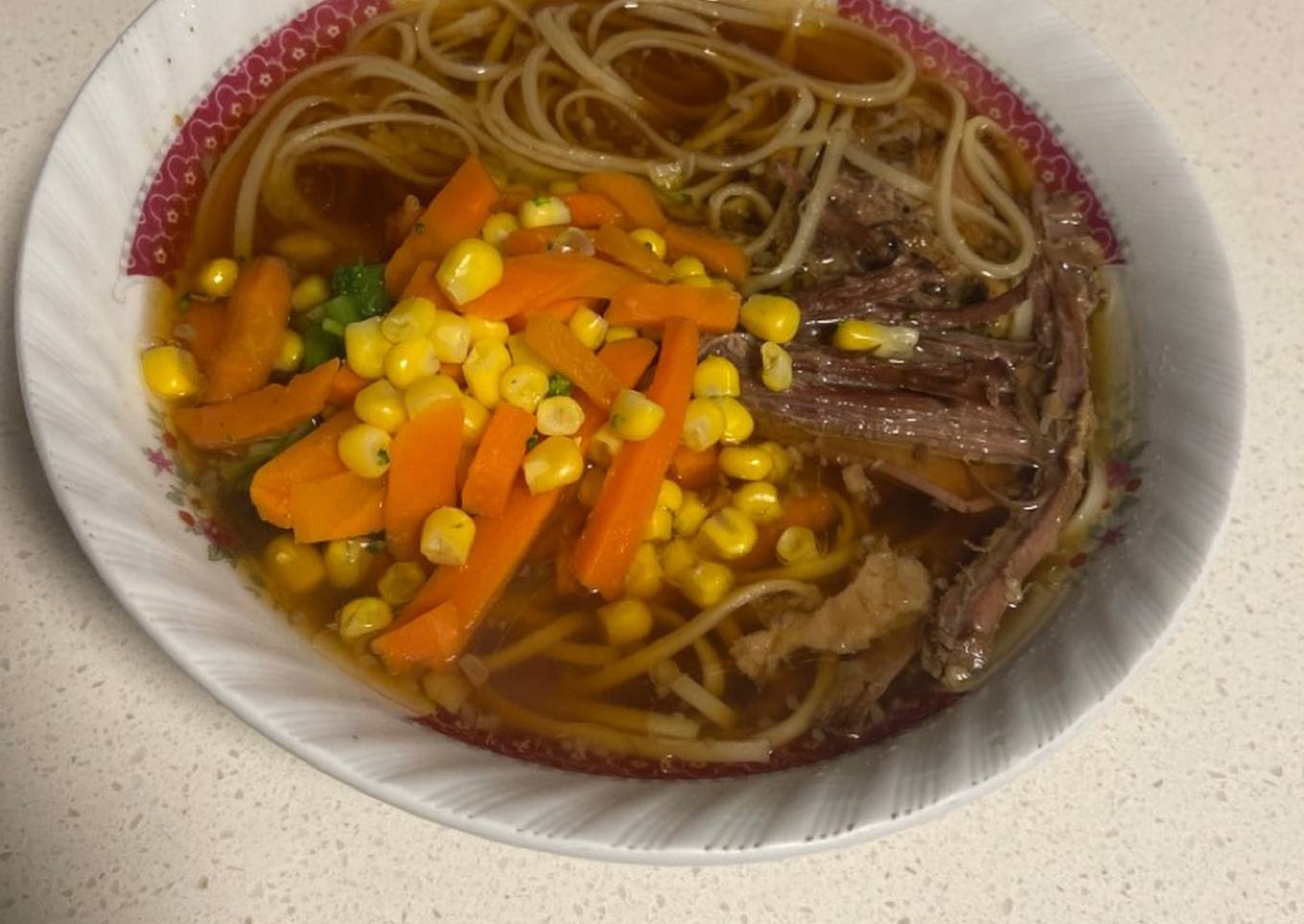 Slow cook beef brisket with noodles
