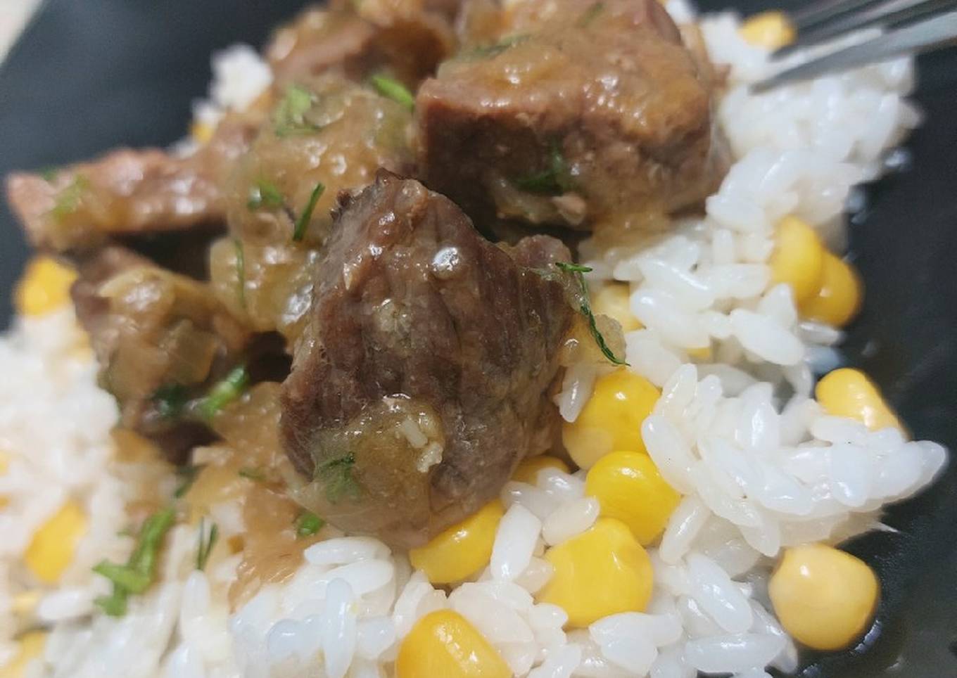 steamed beef with delicious rice corn garnish