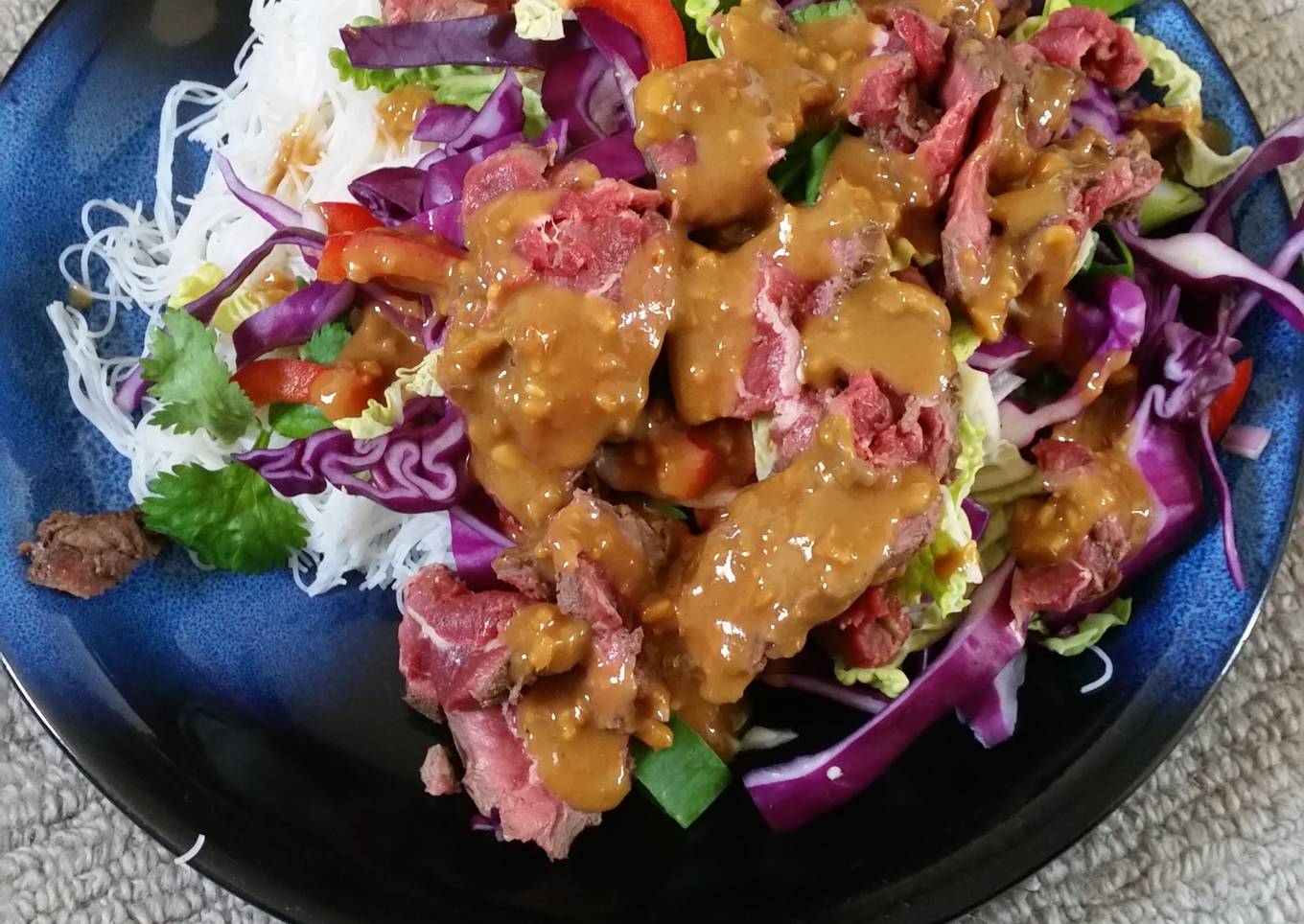 zingy coleslaw satay with rare beef