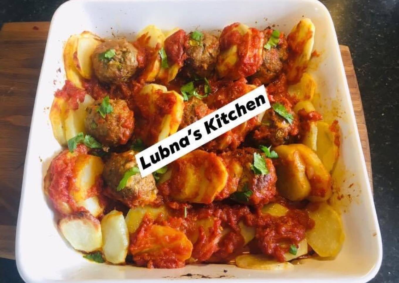 baked meatballs and potatoes in tomato sauce