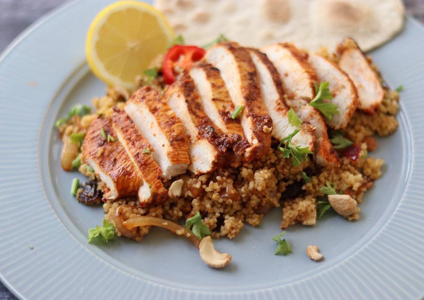 Harissa chicken with couscous and flatbread