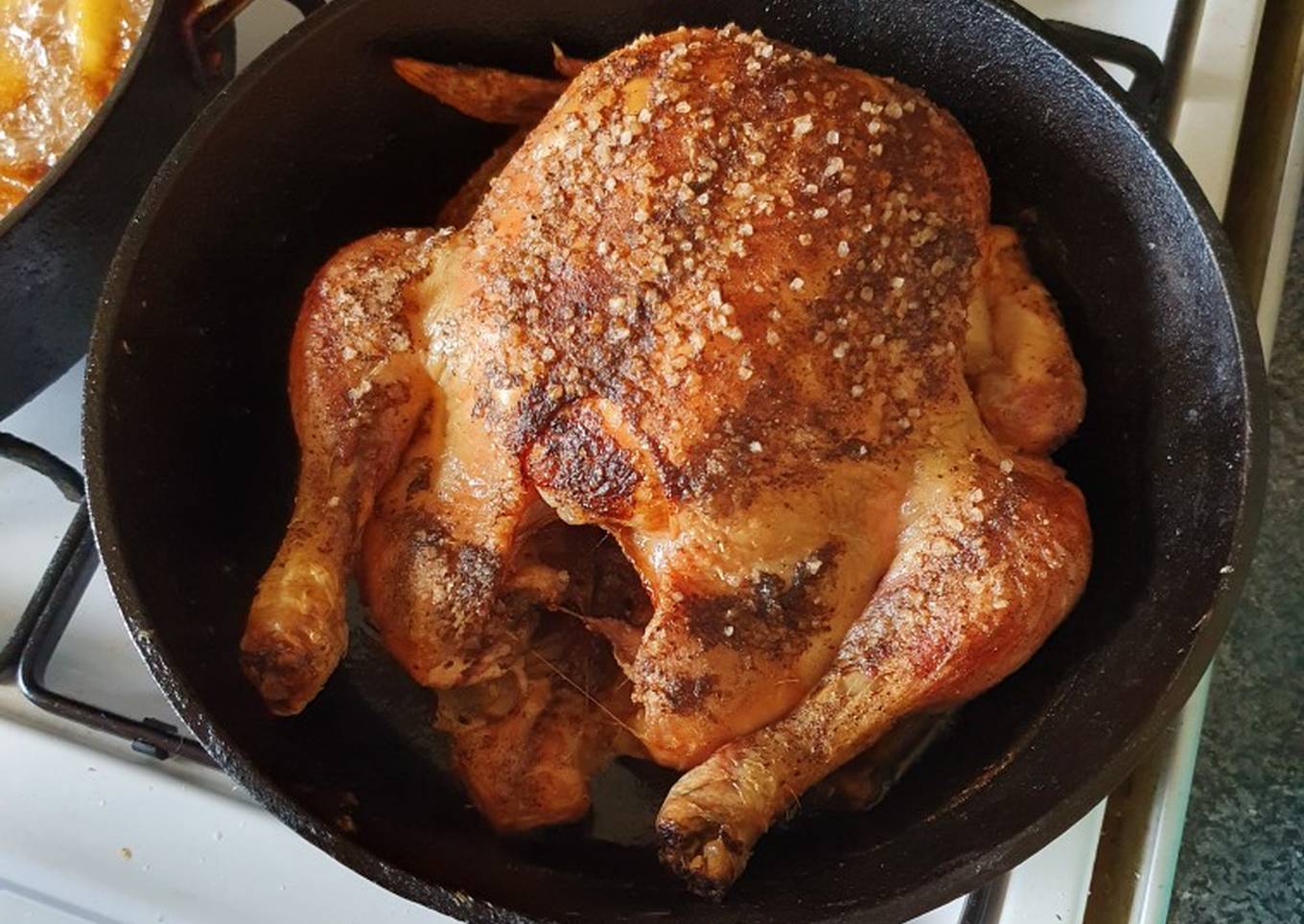 large roasted chicken in skillet